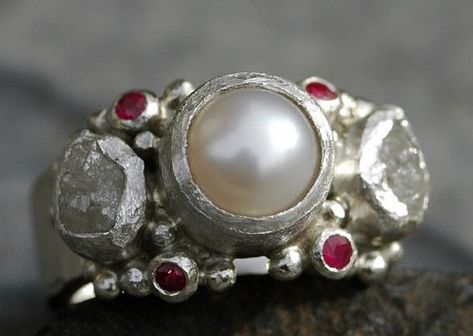 One of my all-time favourite stone combinations for this ring design: white freshwater pearl with tiny pink-red rubies and icy white raw diamonds #pearlring #diamondring #roughdiamonds #rawdiamond #roughdiamondring #ruby #rubyring #handmade #specimental Weddings Ring, Ruby And Pearl, Raw Diamond Rings, Rough Diamond Ring, Ring Ruby, Engagement Band, Wedding Band Sets, White Freshwater Pearl, Raw Diamond