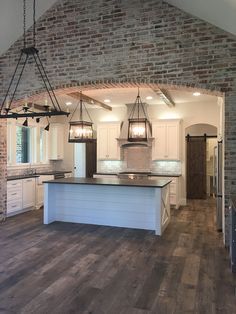 The flooring throughout the house is wood looking tile from Stone Solutions Dakota 8"x48" with grout line of 1/16 to give that wood look. Kitchen Hardwood Tile. La House, Casa Country, Brick Walls, Wood Look Tile, Interior Kitchen, Trendy Kitchen, House Kitchen, House Goals, Style At Home