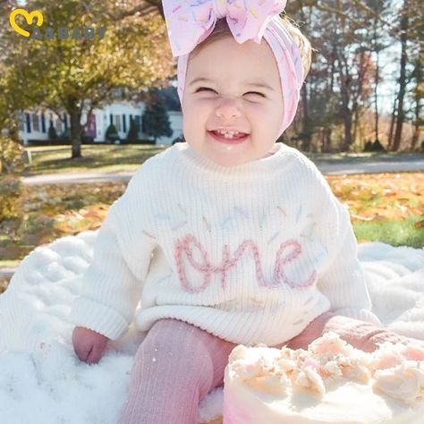 * WHITE IS SOLD OUT!* Celebrate your sweet little ones first year around the sun with our machine embroidered details for baby's FIRST BIRTHDAY (or half birthday!) on a super soft chunky sweater! Complete with multi-coloured confetti! These adorable sweaters fit oversized and make any outfit a knock out! Bonus that you'll get an extra long life out of these sweaters, we know how fast kids grow so these pieces are definitely an investment! Perfect for any special occasion (hint: BABYS FIRST BIRTH Winter First Birthday Photoshoot, First Birthday Present Ideas, One Year Old Birthday Outfit, Sweet One First Birthday, Hand Embroidered Sweater, First Birthday Winter, Winter Birthday Outfit, Birthday Sweater, First Birthday Pictures