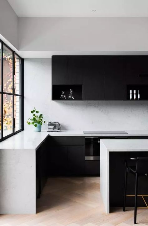 a minimalist black and white kitchen with matte black cabinets, white stone countertops and a backsplash, black stools is a chic space to be Steel Window Design, Black Interiors, White Kitchen Design, Chic Spaces, Victorian Terrace, Kitchen Inspiration Design, Timber Flooring, Black Kitchens, Window Design