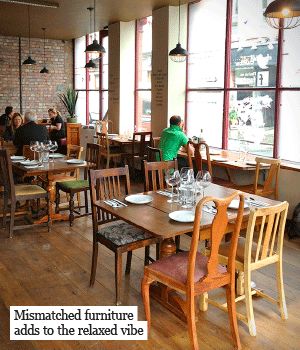 Mismatched furniture - could be painted with cx colours and used in the canteen? Mismatched Chairs Restaurant, Mismatched Furniture Cafe, Community Cafe Ideas, Eclectic Cafe, Community Cafe, Takeaway Shop, Thrifted Furniture, Restaurant Kitchen Design, Cafe Vibes