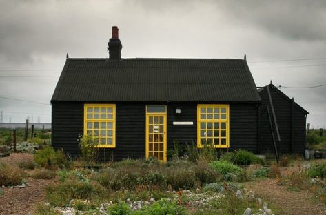 10 Things Nobody Tells You About Painting the Exterior of Your House Black House With Yellow Door, Small Black House, Prospect Cottage, Derek Jarman, Black Cottage, Small House Exterior, Black Houses, Paint Your House, Cabin Exterior