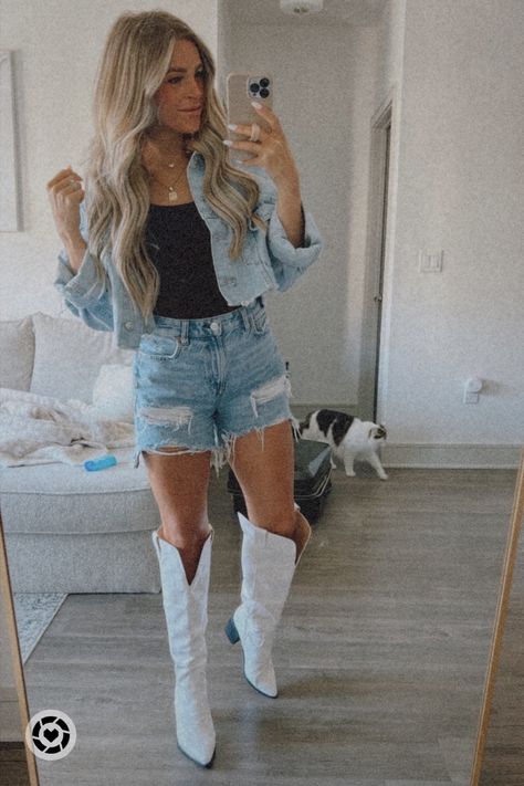 Canadian tuxedo. Distressed denim shorts, cropped denim jacket, white knee high cowboy boots, black bodysuit Follow my shop @_readyinaprosecco on the @shop.LTK app to shop this post and get my exclusive app-only content! #liketkit #LTKunder100 #LTKshoecrush #LTKstyletip @shop.ltk https://liketk.it/4gneq Denim On Denim Cowboy, Jean Jacket And Cowboy Boots, White Boots And Shorts Outfit, Jean Shorts Boots Outfit, White Knee High Cowboy Boots, Cowboy Boots And Shorts Outfit, Shorts And Boots Outfits, Skirt And Cowboy Boots Outfit, White Cowgirl Boots Outfit