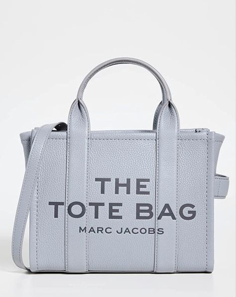 A fresh version of Marc Jacobs's signature mini Traveler tote, offered this time in rich pebbled leather. All the hallmarks of the original style remain: bold block lettering, boxy shape, and everyday versatility. #bagsandpurses #bags #tote #purse #pursesandhandbags #pursesandbags #fashion #style #stylish #womenfashion #amazonaffiliatelink Marc Jacobs Tote, Large Leather Tote Bag, Large Leather Tote, Small Tote Bag, Marc Jacobs Bag, The Tote Bag, Moda Vintage, Medium Tote, Small Tote