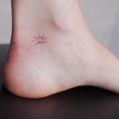 15 Beach-themed tattoos to get to feel like you're on holiday Wave Tattoo Small, Sun Wave Tattoo, Tiny Sun Tattoo, Beach Theme Tattoos, Small Sun Tattoo, Wellen Tattoo, Tattoo Wave, Tattoo Sonne, Simple Tattoos For Women