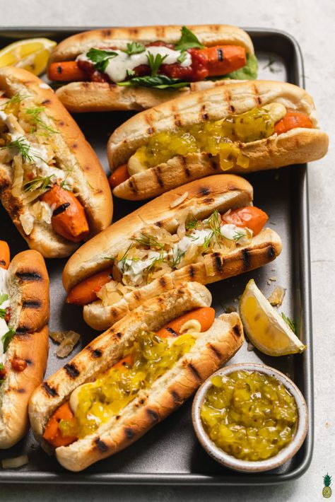 loaded vegan carrot hot dogs on a sheet pan with lemon and relish by sweet simple vegan. #veganbbq #veganjunkfood #vegano Food Truck Recipes, Carrot Hot Dogs, Easy Vegan Food, Vegan Food Truck, Vegan Ravioli, Vegan Hot Dog, Grilled Carrots, Carrot Dogs, Fried Goat Cheese