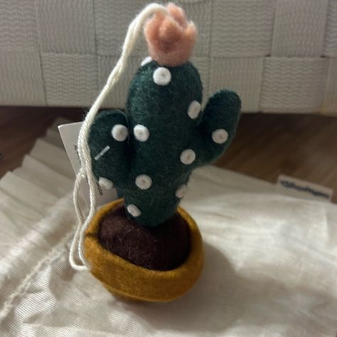 Sunrise Blossom Cactus Ornament Nwt Prepped In A Cute Little Planter, Our Charming Felt Sunrise Blossom Cactus Ornament Wants To Latch On And Go Home With You. Hang Her From The Rear View Mirror Or Attach Her To A Desert Gift. She Looks Lovely On A Desert Holiday Tree. All Details And Stitching Are Hand-Embroidered. Our Ornaments Come Ready To Hang With A String Attached. Made From Sustainably Harvested, Locally-Sourced Merino-Wool. Fairly Trade And Made With Love. H:4.5"/11.5cm W:2.25"/5.5cm L: Hand Felting, Felt Cactus, Hand Felted, Holiday Tree, Rear View Mirror, Rear View, Needle Felting, Hand Embroidered, Merino Wool