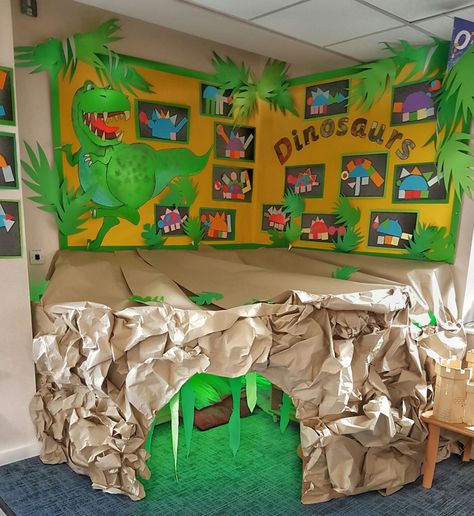 Sep 29, 2016 - Reading Area Cave themed dinosaurs. Made out of cardboard, parcel paper, LED lights and a speaker for sound effects Dinosaur Reading Corner, Dinosaur Bulletin Boards, Science Lab Decorations, Dinosaur Display, Thema Dino, Dinosaur Classroom, Dinosaur Island, Reception Classroom, Elementary Classroom Themes