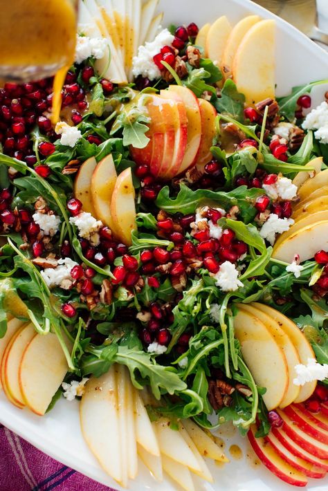 This gorgeous holiday-colored green salad is easy to make. Made with fresh pomegranate, pear, apple and arugula, it will really brighten up your table! #healthysalad #saladrecipe #pomegranatesalad #pearsalad #holidaysalad #cookieandkate Pomegranite Salad, Holiday Salad, Christmas Salad Recipes, Holiday Salads, Christmas Salads, Pomegranate Salad, Green Salad Recipes, Pear Salad, Ginger Dressing