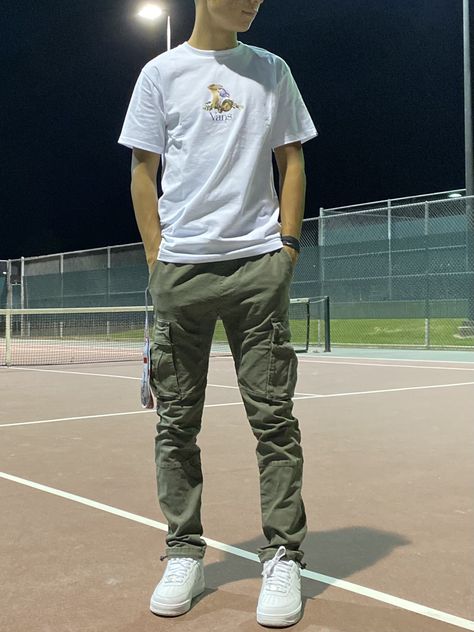 Mens Olive Cargo Pants Outfit, Green Cargo Pants White Shirt Outfit Men, Olive Cargos Outfit Men, Cargo Pants Air Force Ones, Cargo Pants Vans Outfit Men, Cuffed Cargo Pants Outfit Men, White Shirt And Olive Green Pants Men, Men’s Fashion Cargo Pants, Olive And White Outfit