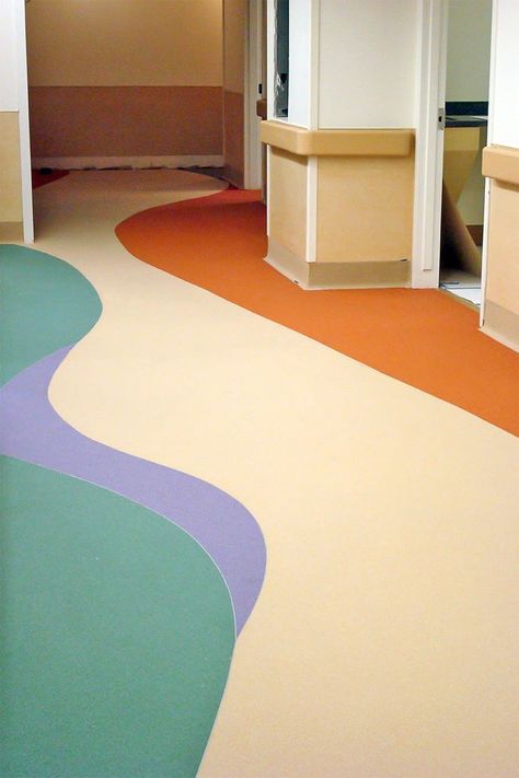 Healthcare workers are on their feet for hours at a time. To meet the critical needs of others, comfort flooring takes the art of human engineering to a next level. Check out floors that provide outstanding ergonomics so you can stand comfortably when we need you the most! #stonhard #healthcare #hospital #medical #flooring #epoxy #commercial Hospital Flooring, Flooring Epoxy, Healthcare Interior Design, Colorful Playroom, Floor Graphics, Kindergarten Design, Hospital Interior, Kids Flooring, Pvc Flooring