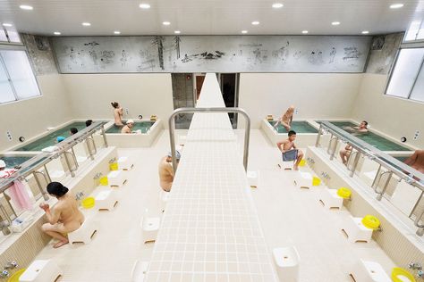 In a time when public bathing is rapidly diminishing in popularity, designer Jo Nagasaka took on the task of modernizing a local sento, or Japanese bathhouse, called Koganeyu. Jo’s imaginative work engages tradition and contemporary style in one space. To bring modern appeal and maintain Koganeyu’s focus on community and togetherness, Jo introduced an updated […] Japan Bathhouse, Bathhouse Japanese, Japanese Public Bath, Public Shower, Lavatory Design, Open Ceiling, Small Bars, Public Bathrooms, Public Bath