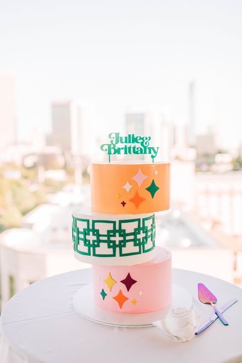 colorful green, pink, and orange retro mid century inspired wedding cake Colorful Midcentury, Colorful Table Decor, Late Night Pizza, Crystal Birthday, Atlanta Skyline, Wedding Reception Seating, White Cakes, Orange Retro, Modern Cakes