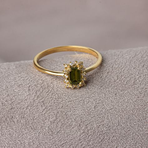 With its shimmering pale green color, peridot stone is also known as the "evening emerald". It is a gemstone often associated with spirituality and expression. Our rectangular peridot stone ring surrounded by real diamonds will add elegance to your hands. It is a ring that you can use both on special occasions and in daily life. It is a beautiful and stylish product that you can gift to yourself and your loved ones. The color of those born in August is Peridot. Our necklace compatible with our r Diamond And Peridot Engagement Rings, Ring With Green Stone, Peridot Birthstone, Woman Jewelry, Peridot Jewelry, Peridot Stone, Peridot Ring, Peridot Gemstone, Emerald Engagement Ring