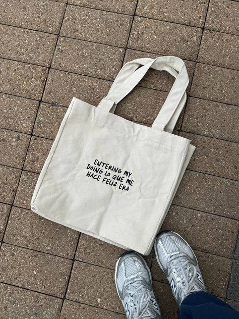 It's our best era yet and we're bringing this tote bag along for the ride. * Vintage Black Tote Bag/ Ivory Embroidered design * Tote bag Measurements:  * W: 13" H: 13" D: 6" Advertising Clothing, Desain Tote Bag, Totes Ideas, Quote Tote Bag, Design Tote Bag, Along For The Ride, Happy Hippie, Bag Mockup, Diy Tote Bag