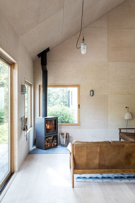 Photo 7 of 14 in This Minimalist Home in Maine Channels the Spirit of a Scandinavian Cottage - Dwell Mountain House Interior, Minimalist Cabin, Minimalist Cottage, Scandinavian Cabin, Scandinavian Cottage, Cabin Fireplace, Plywood Interior, Cape Elizabeth, Bungalow Renovation