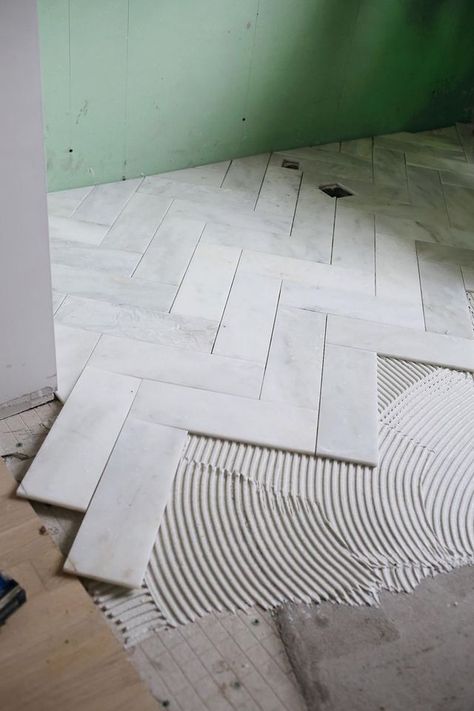 Cut down 12x12 basic tiles for this Herringbone Marble Tile | A Beautiful Mess | Bloglovin’ Unique Bathroom Tiles, Marble Bathrooms, Marble Tile Floor, Master Bath Remodel, Herringbone Tile, Unique Bathroom, Trendy Bathroom, Bathroom Floor Tiles, Marble Bathroom