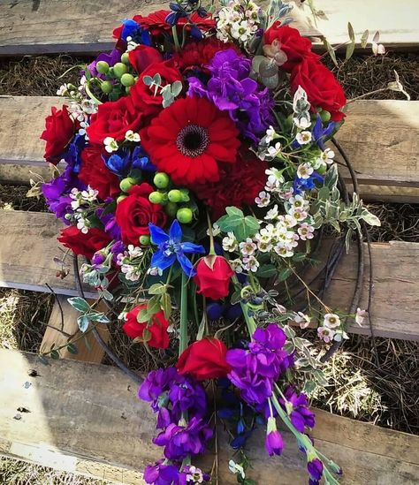 Vibrant wine country inspired cascade bouquet. Ruby Red, Grape and Royal Blue. Created by The Flower Basket, Deerfield Township Michigan. Red Grape, Cascade Bouquet, Flower Basket, Wine Country, Ruby Red, Royal Blue, Grapes, Michigan, Floral Wreath