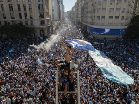 Fans across Argentina gathered around the waving the national flag and raised posters of their hero Lionel Messi after their team's epic FIFA World Cup final win. The team emerged victorious after defeating the defending champions France on Sunday. It was the country’s third World Cup title, and the first since 1986. Rodrigo Abd/APFans could be seen singing, dancing on the streetsSwathes of crowds erupted in Argentina's Buenos Aires after the national football team ‘La Albiceleste’ clin Football Crowd, Argentina Fans, Argentina Players, Argentina Team, Argentina World Cup, Argentina Football, World Cup Winners, Soccer Match, World Cup Final