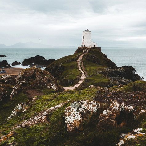 The "island" of Ynys Llanddwyn is only accessible at low tide. When exploring, you have to make sure you keep track of the tide times! It features the ruins of a chapel that was dedicated to the Welsh equivalent of St. Valentine (and the equivalent day falls on the 25th of January instead of the 14th of February). Also located on the island are a couple of lighthouses, one of which is still in use, as the island serves as a desirable location near shipping routes into the Menai Strait. #sno... Ynys Llanddwyn, St Valentine, The Ruins, Lighthouse, Track, Quick Saves, Ruins