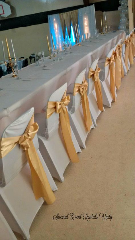 white spandex chair covers gold sashes Gold Chair Covers, White Seat Covers, Simple Church Wedding, Ivory Chair, White Chair Covers, Gold Tulle, White Spandex, Prom Decor, Chair Covers Wedding