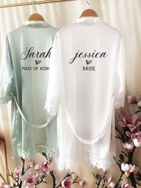 Add these stunning satin robes to your wedding experience, creating memorable moments for your bridal party. These robes also make perfect bridesmaid gifts and are perfect for relaxing on hen weekends.  These robes can be personalised with name on the back for just a girly holiday, as a treat for a loved one or some self-love to yourself!  Crafted with luxury in mind, they add a touch of elegance to any occasion. This style of robe is available in a variety of colours and sizes: One Size: Bust:1 Bridal Robes Personalized, White Bridal Robe, Bridesmaid Robe Personalized, Colour Text, Wedding Robes, Lace Bridal Robe, Gown Bridesmaid, Wedding Morning, Bridal Party Robes