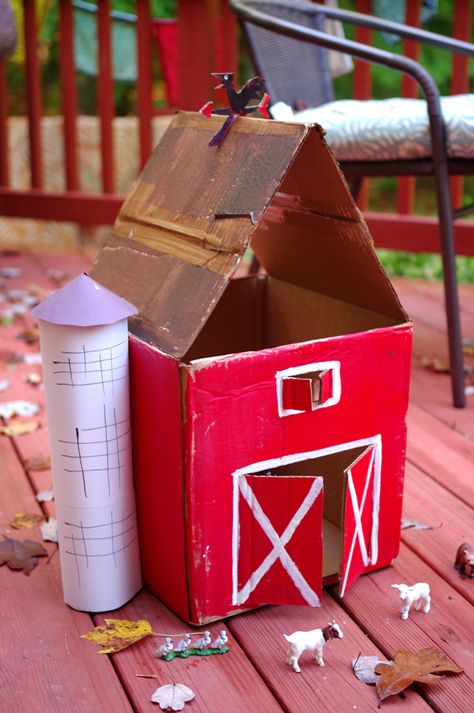 We made a cardboard farm a little like this one...cut open back to make a working "door" to store all accessories and animals. Added popsicle sticks glued together and painted white for picket fences and a gate, made a bale of hay from cardboard and yellow felt, green felt for grass for our cows and horses and sheep, blue felt cut into the shape of a pond for our wooden ducks, geese, etc. Brown felt cut into shape of mud puddle for our wooden pigs, then painted crops on a flat piece of cardboard Barn Crafts, Shoe Box Crafts, Do Crafts, Farm Animal Crafts, Crafts And Activities For Kids, Barn Wood Crafts, Farm Projects, Farm Crafts, Animal Crafts For Kids