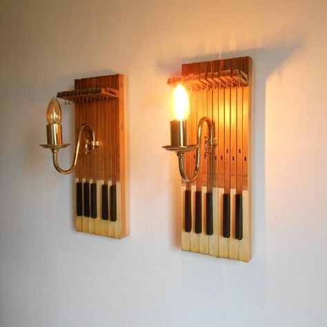 A pair of repurposed wall lamps with antique piano keys by Fiona Bradshaw Designs Recycled Piano Keys, Piano Parts Repurposed Vintage, Piano Key Crafts, Piano Parts Repurposed, Piano Keys Repurposed, Upcycle Piano, Repurposed Instruments, Sustainable Lighting, Key Crafts