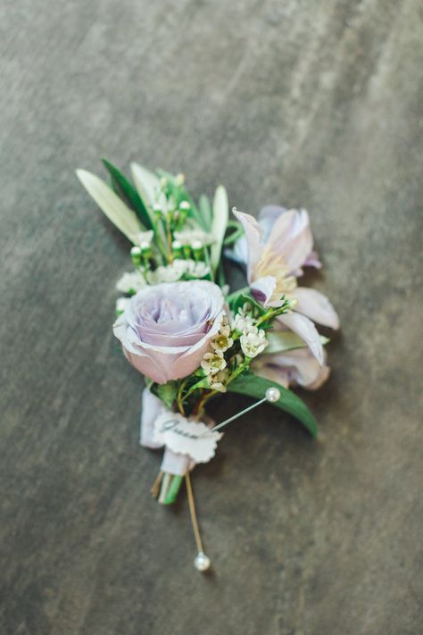 Lavender spray rose boutonniere with clematis and waxflower. Trisha Kay Photography. Lavender Boutonniere Groomsmen, Lavender And Sage Boutonniere, Pink And Purple Boutonniere, Lavender Rose Corsage, Light Purple Corsage And Boutonniere, Spray Roses Boutonniere, Fall Boutonnieres, Succulent Boutonniere, White Boutonniere