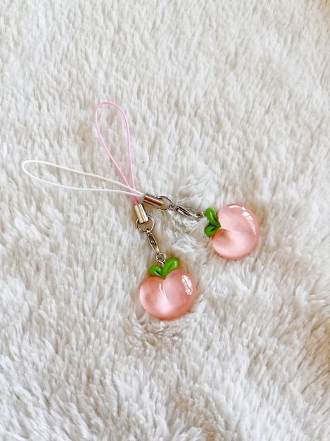 Adorable cartoon style resin peach keychain/phone charm! Perfect for yourself or a friend~  **If you would like a different cord color, please message us! We are able to accommodate most colors/requests Peach Keychain, Peach Resin, Cartoon Peach, Purse Decor, Fruit Keychain, Backpack Ideas, Keychain Phone, Adorable Cartoon, Kawaii Cartoon