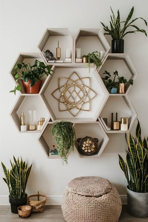 Elevate your boho-inspired space with hexagonal or mandala shelving. These unique patterns offer functional storage while adding a spiritual, artistic vibe to your home decor. #GeometricShelving #BohoDecor #ModernBohoVibes #SpiritualHome #HexagonalShelves #MandalaDesign #DecorWithMeaning #GreeneryAndCrystals #HomeStylingInspo #BohoLivingSpace Spiritual Living Room Aesthetic, Hexagon Shelves Decor, Zen Den Ideas, Hexagon Shelf Decor, Spiritual Room Ideas, Healing Room Ideas, Boho Shelf Decor, Spiritual Room, Shelves Decor