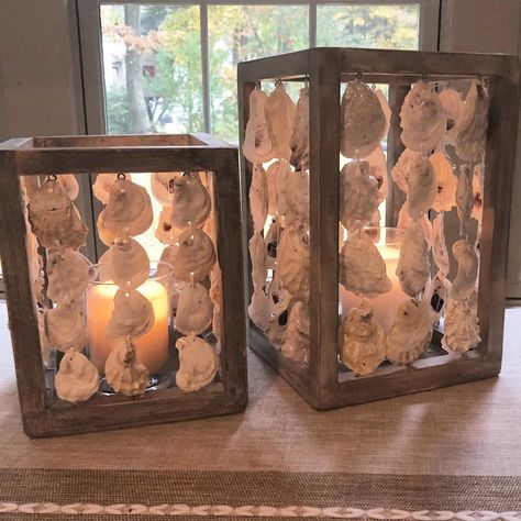 On a dreary, rainy day these oyster shell lanterns add a warm glow reminding one of warm evenings on the beach watching the sunset. Oyster Candle, Coastal Table Decor, Oyster Shells Decor, Beach Products, Shell Table, Table Lanterns, Diy Beach Decor, Oyster Shell Crafts, Seashell Wall Art