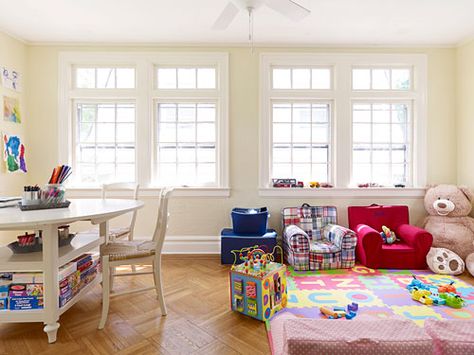 Once wall-to-wall with kids' stuff, the Ruffo's edited sunroom now has specific spots for toys. On the floor, foam mats delineate areas for toys and play. Removing the blinds also floods the room with light so it seems airier. Sunroom Playroom, Basement Steps, Cleaning Kids Room, Sunroom Addition, Sunroom Decorating, Basement Living Rooms, Getting Rid Of Clutter, Extra Rooms, Home Additions