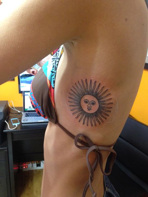 For a while I wanted to get this tattoo. I was born in Argentina so I wanted to do something representative of my country; I decided to get the sun from the flag tattooed on my rib cage. Argentina Tattoo Ideas, Argentina Tattoo, Ripped Skin Tattoo, Best Tattoo Ideas For Men, Africa Tattoos, Tattoo Maker, Web Tattoo, Best Tattoo Ideas, Flag Tattoo