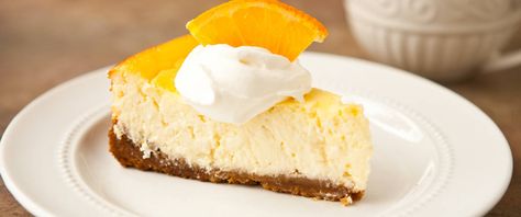 Zesty oranges and tangy Greek yogurt are the secret to this indulgent-tasting twist on traditional cheesecake. Add a drizzle of chocolate or caramel topping for a dramatic finish. Greek Yogurt Cheesecake, Yogurt Cheesecake, Orange Cheesecake, Gingersnap Crust, Classic Cheesecake, Caramel Topping, Springform Pan, Creamy Cheesecake, Cheesecake Recipe