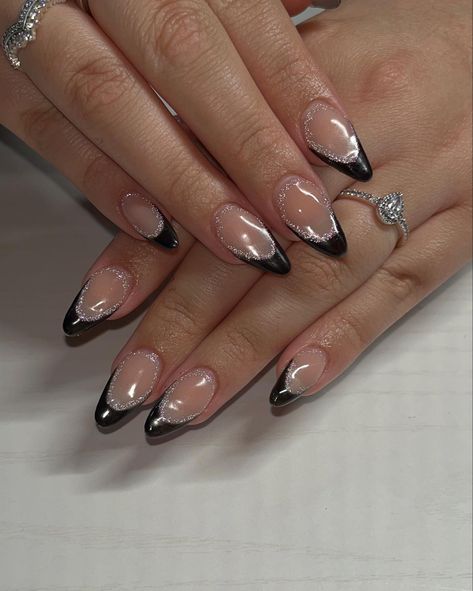 Black French tip nails with a touch of reflective glitter #frenchtipnails #reflectiveglitter #nailinspiration #newyearsnails Mail Ideas For Black Dress, Black Nails With Glitter Almond Shape, Black And Silver Nails Almond Shape, Nails With Black Sequin Dress, Black French Tip With Sparkle Line, Black Shimmer French Tip Nails, Black Metallic French Tip Nails, Nails Matching Black Dress, Prom Nails For Black Dress Simple