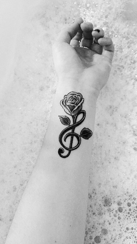 my treble clef tattoo & a rose growing out of it. Rose Tattoo With Music Notes, Floral Treble Clef Tattoo, Treble Clef And Flower Tattoo, Music Rose Tattoo Design, Treble Clef With Rose Tattoo, Small Music Tattoos, Treble Clef Tattoo, Font Tato, Tattoo Old School