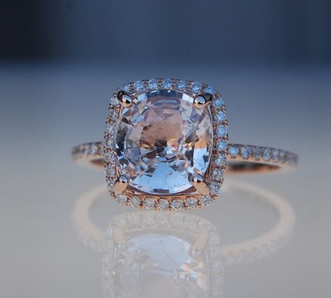 Something different. More bang for your buck. Would match gold and silver I think.  2.6ct cushion ice peach champagne sapphire 14k rose gold diamond ring engagement ring