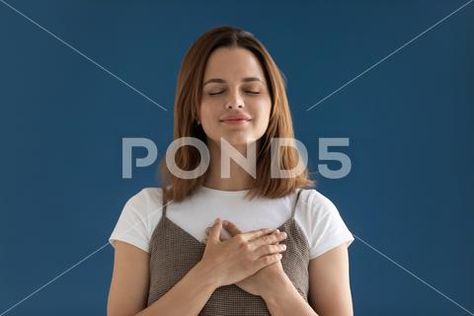 Woman Holding Something Reference, Woman Holding Head In Hands, Woman Resting Head On Hands, Woman Holding Heart, Woman Hugging Herself, Hands On Chest, Blue Studio Background, Girls Holding Hands, Holiday Flyer Design