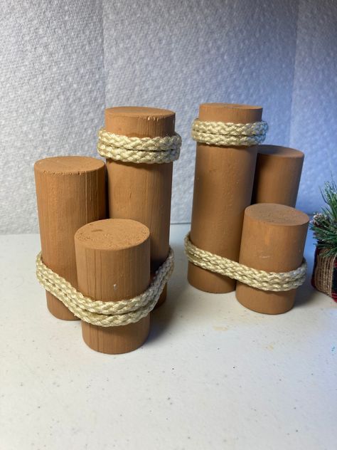 "You will enjoy a size we call \"Mini\" nautical beach pilings. Painted with a natural brown that will represent the season or theme you are creating.                                                             They come in a set of two - use them on shelves, trays, office desk, tables or pool bar area.  Each set may vary slightly due to hand made and nature of product.  Distressed weathered look or not, pastel colors, leave natural or distinctive look, have fun with the colors.   Rope is added in two areas for that special look.              Size: height 4\", 3\", 2\".                          Diameter 1  1/4\".                                            Made to order" Pilings Nautical, Nautical Pilings, Beach Themed Crafts, Disney Enchanted, Tiki Decor, Nautical Crafts, Ocean Birthday, Vbs Themes, Beach Party Decorations