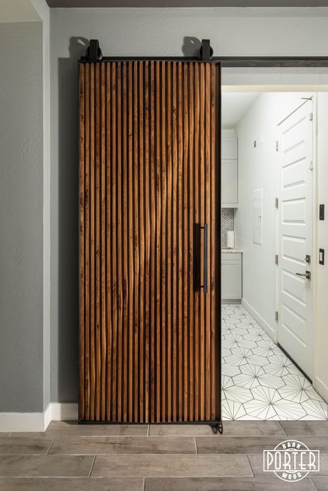 Walnut sliding door featuring custom parametric design for customer’s laundry room. Makes you want to get the chores done! Unique Sliding Door, Mid Century Sliding Door, Mid Century Modern Sliding Door, Mid Century Modern Barn Door, Unique Sliding Doors, Wood Sliding Door Design, Wooden Sliding Door Design, Slat Barn Door, Sliding Door Modern