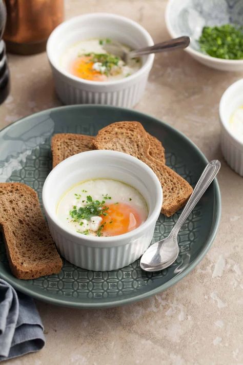 Learn how to make delicious French baked eggs, also known as oeufs cocotte, with this simple and customizable recipe. Perfect for breakfast, brunch or any meal of the day! French Baked Eggs, Props For Food Photography, French Eggs, Easy Breakfast Smoothies, Full Fat Yogurt, French Recipes, Gluten Free Egg Free, Grain Free Granola, Meal Of The Day