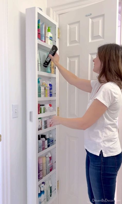 Behind the door storage cabinet filled with bathroom products Behind Door Storage, Closet Door Storage, Cabinet Door Ideas, Instagram Messages, Laundry Doors, Bathroom Storage Ideas, White Storage Cabinets, Utility Closet, Home Organization Ideas