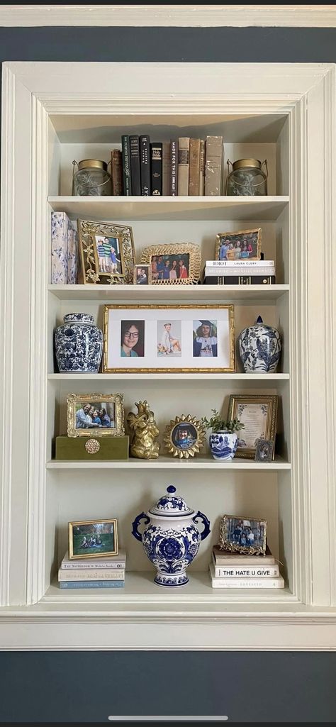 Chinoiserie Bookcase Styling, Traditional Bookshelf Decor, Bookshelf Picture Frames Display, Traditional Bookshelf Styling, Bookshelf Molding, Styling Bookshelves Living Room, Den Cabinets, Bookcase Arrangements, Decorating Bookcases