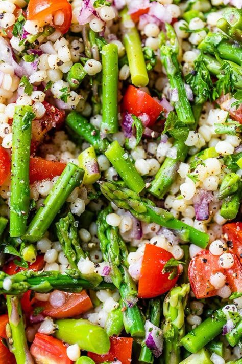 Lemon Asparagus Couscous Salad with Tomatoes makes a vibrant Spring pasta salad, perfect to bring to a potluck or to serve as a BBQ side dish. #potlucksidedish #sidedish #salad #asparagus #bbqsidedish Asparagus Couscous, Salad Asparagus, Spring Pasta Salad, Spring Side Dishes, Bbq Side Dish, Salad With Tomatoes, Potluck Side Dishes, Lemon Salad, Spring Pasta