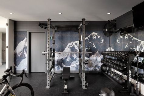 This Calgary Basement Home Gym Balances Style and Function - Avenue Calgary Gym Wall Mural, Home Gym Wall, Basement Home Gym, Multifunctional Room, Basement Home, Mountain Mural, Mechanical Room, Gym Wall, Glass Partition