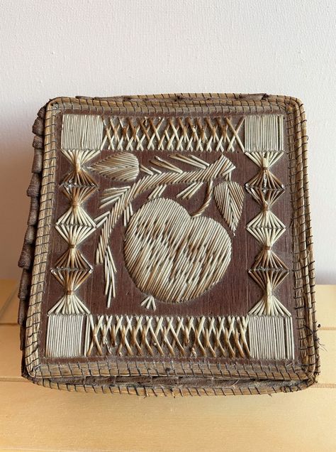 Vintage, collectible porcupine quill and birch box lined in cloth. Cover/lid of box features a piece of fruit on a vine (perhaps Guava?) along with geometric and lattice patterns. Edges (of perhaps straw or sweet grass) are neatly stitched. There is some minor damage with the small, brittle pieces of quill having broken. Please visit our shop on Etsy for more photos and more information. Age and further history unknown. Size: 5 3/4 inches by 5 1/4 inches by 2 1/8 inches Porcupine Quill Art, Birch Box, Quill Art, Quill Work, Porcupine Quills, Information Age, Bark Box, Lattice Pattern, Birch Bark