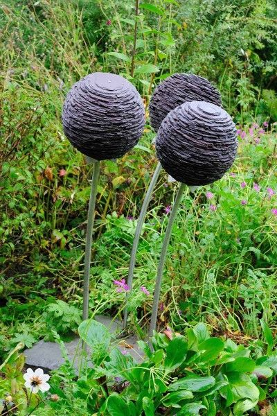 Joe Smith stacked slate sculpture | Slate alliums by Joe Smith http://www.joe-smith.co.uk/ Slate Sculpture, Penny Ball, Sculpture Aesthetic, Totem Pole Art, Pole Art, Swimming Pond, Bird Baths, Uk Garden, 3d Sculpture