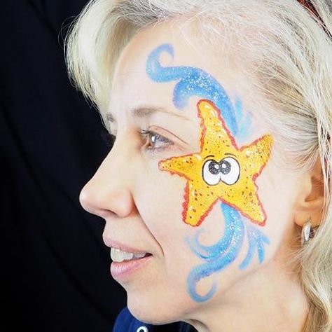 Get Ready for the Beach With This Glittering Starfish Tutorial – ClownAntics Sea Creatures Face Painting, Sea Creature Face Paint, Under The Sea Face Painting, Under The Sea Face Paint, Beach Face Paint, Ocean Face Paint, Yellow Face Paint, Mermaid Face Paint, Blue Face Paint