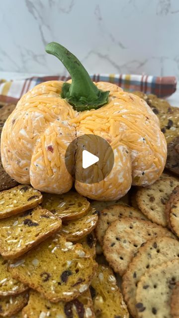 Jacqueline Vignona | Easy & Delicious Recipes on Instagram: "Save & Share this PUMPKIN CHEESE BALL for your Fall Gatherings 🎃 Follow for more recipes!

What you’ll need:
16 ounces of softened @phillycreamchs cream cheese 
2 tablespoons of everything but the bagel seasoning
1/3 cup @harryanddavid pepper & onion relish 
1 1/2 cup cheddar cheese

How to make it:
Add all the ingredients to a bowl & mix well. Next form a ball with the cheese & lay down 1/2 cup of cheddar cheese on Saran Wrap. Add the cheese ball on top & cover with an additional 1/2 cup of cheddar cheese. Cover the cheese ball with cheddar cheese with hands then wrap tightly in the Saran Wrap. Use kitchen twine to form the pumpkin indents & refrigerate overnight. Unwrap the cheese ball & top with a bell pepper stem & serve wit Pepper Onion Relish, Pumpkin Cheese Ball, Cheese Logs, Everything But The Bagel Seasoning, Halloween Charcuterie, Everything But The Bagel, Cheese Log, Office Snacks, Bagel Seasoning